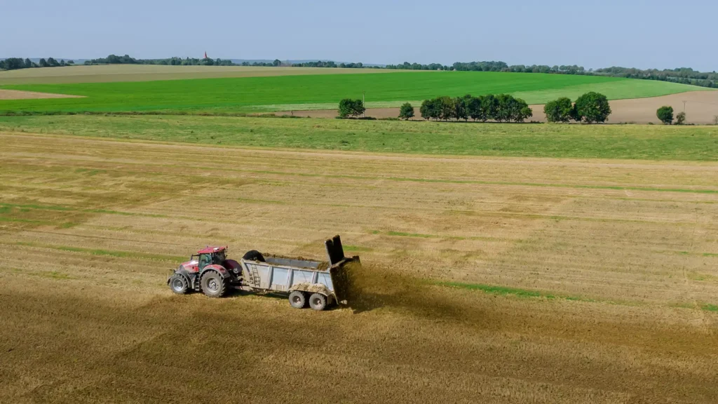 A Chowns Agricultural Services An aerial view of a tractor farming in a field in Worcestershire.