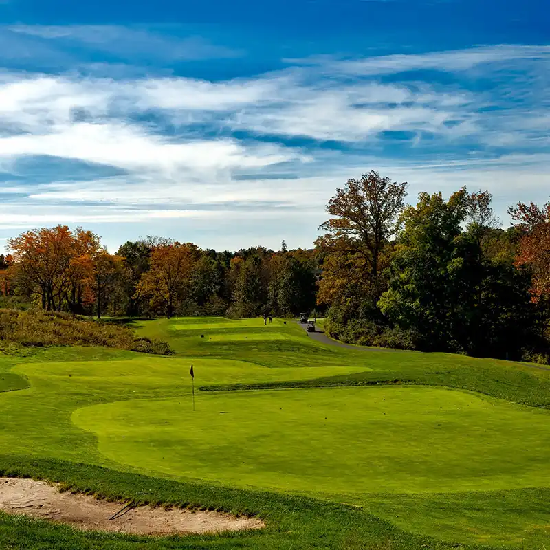 A Chowns Agricultural Services A Worcestershire golf course with trees and a sand bunker.