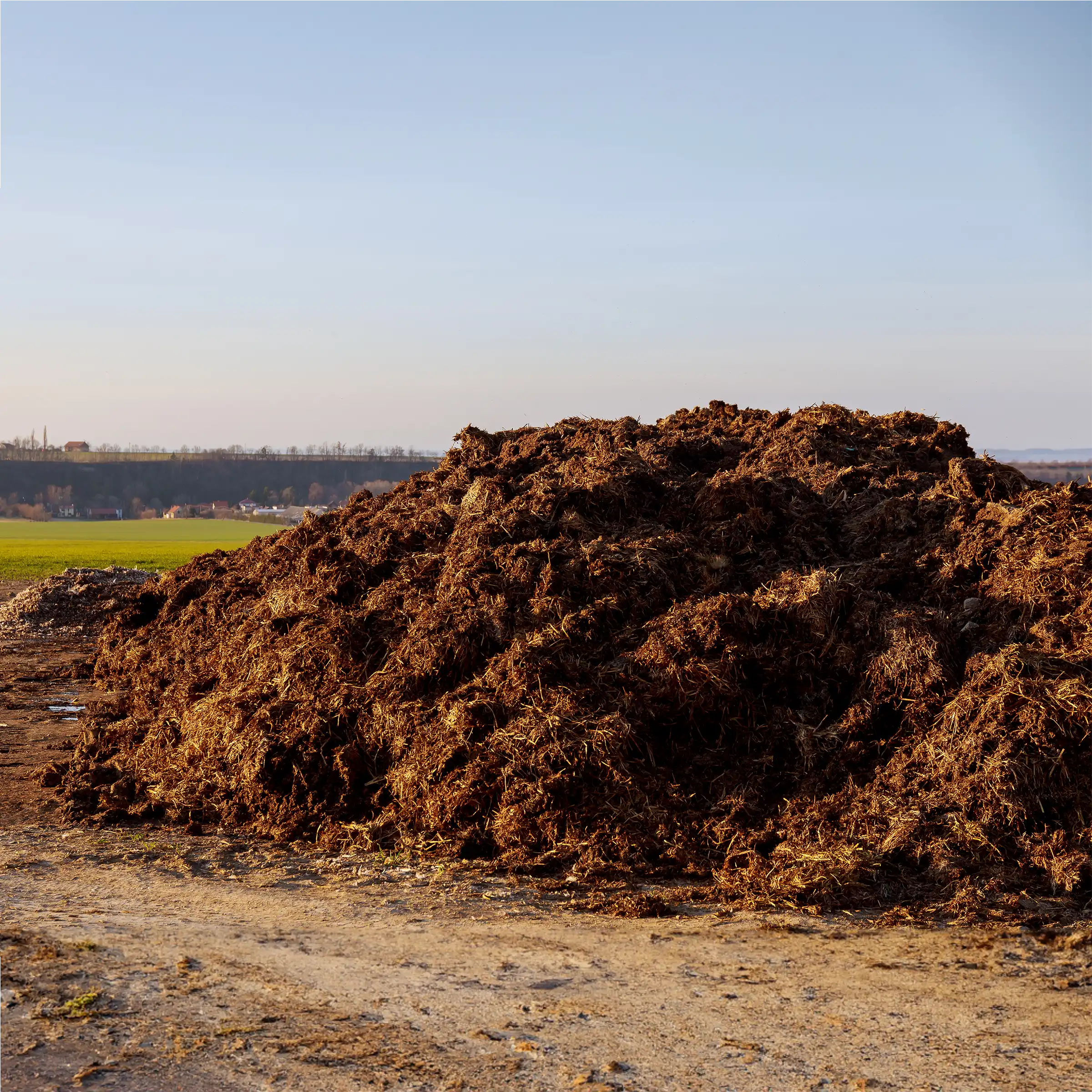 A Chowns Agricultural Services A pile of dirt on a dirt road in Warwickshire.