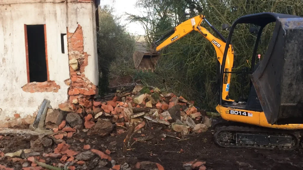A Chowns Agricultural Services An excavator is being used in Worcestershire to dig up a house.
