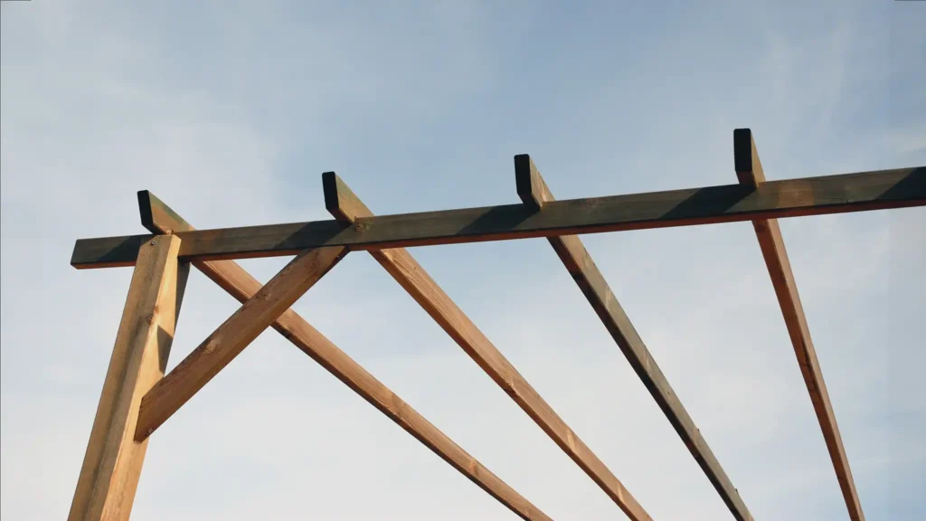 A Chowns Agricultural Services A view of a wooden structure against a blue sky in Warwickshire.