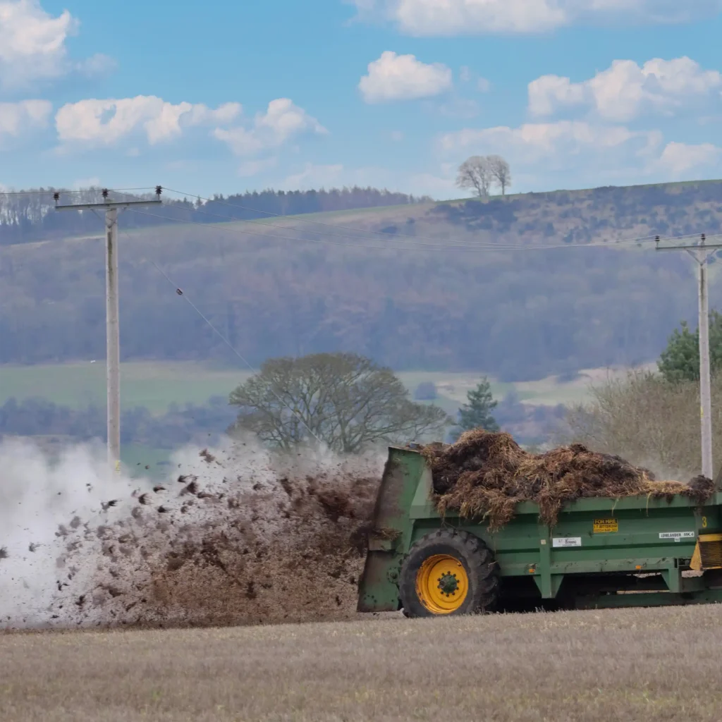 A Chowns Agricultural Services A green tractor in a field in Warwickshire.