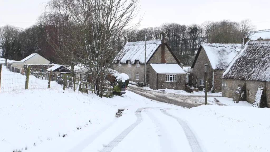 A Chowns Agricultural Services A snow covered road leads to a small village nestled in Worcestershire.